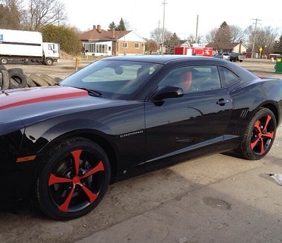 custom red wheels installed on black car